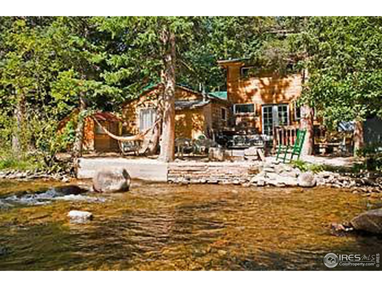 2817 Riverside Drive Lyons, CO 80540 - Photo 1 of 27 Back of Cabin (River side)