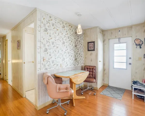 a kitchen with cabinets and window