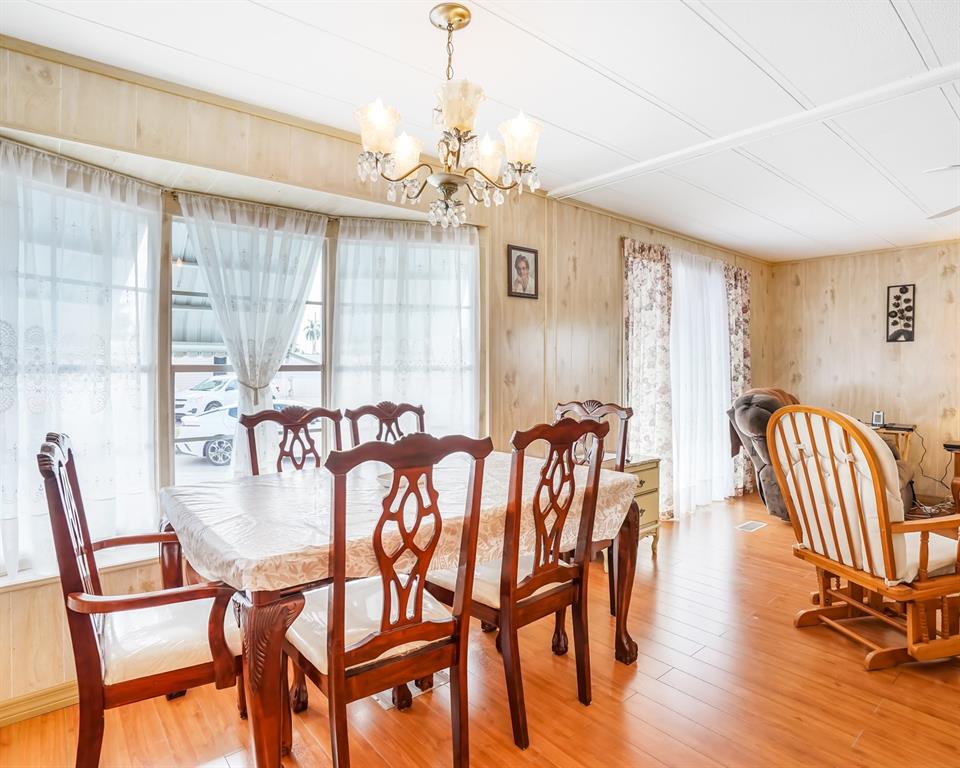 8517 Southwest 16th Place Davie, FL 33324 - Photo 19 of 28 a view of a dining room with furniture window and wooden floor