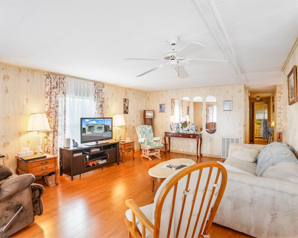 8517 Southwest 16th Place Davie, FL 33324 - Photo 23 of 28 a living room with furniture fireplace and a large window