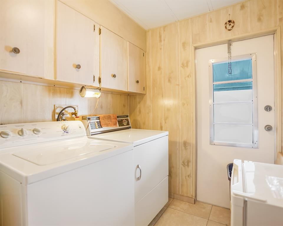 8517 Southwest 16th Place Davie, FL 33324 - Photo 27 of 28 a utility room with dryer and washer