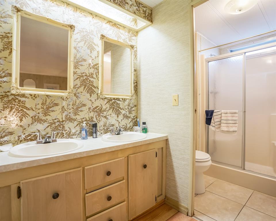 8517 Southwest 16th Place Davie, FL 33324 - Photo 6 of 28 a bathroom with a sink a toilet and shower