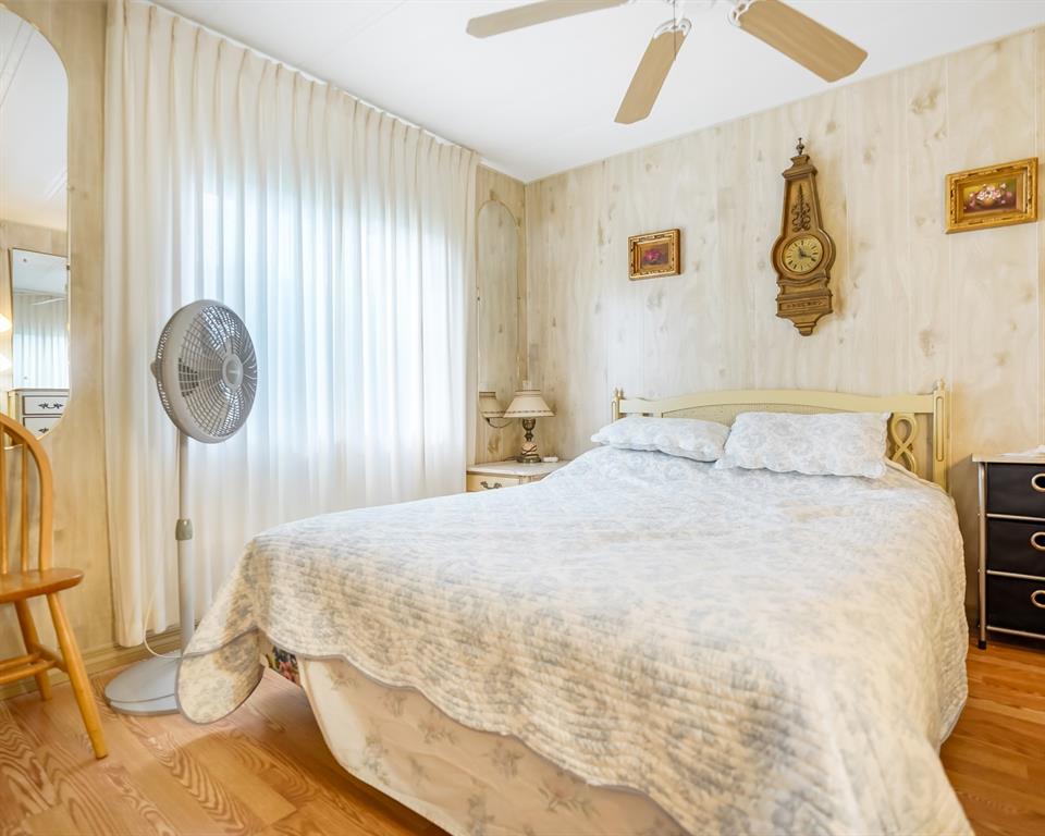 8517 Southwest 16th Place Davie, FL 33324 - Photo 7 of 28 a bedroom with a bed and a painting on the wall