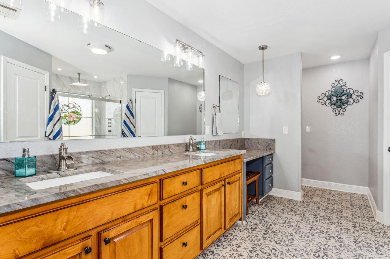 6256 Evan Circle Crestview, FL 32536 - Photo 19 of 46 a bathroom with double vanity sink and a mirror