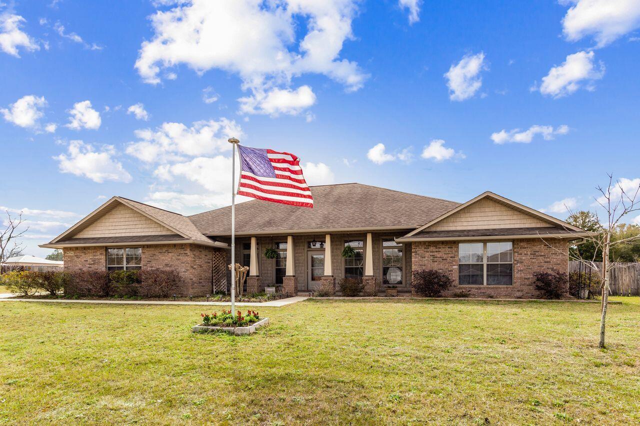 6256 Evan Circle Crestview, FL 32536 - Photo 2 of 46 a front view of a house with swimming pool
