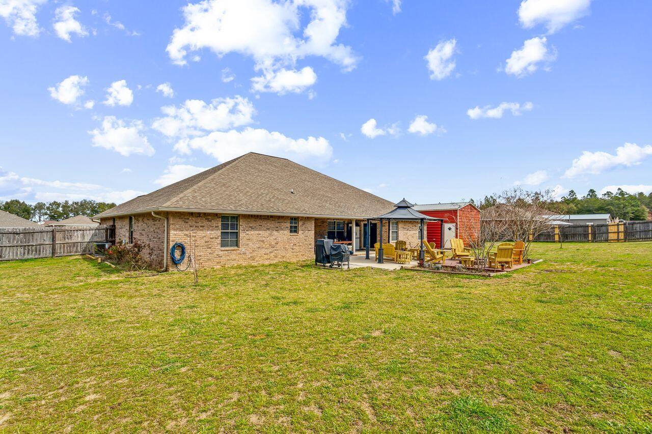 6256 Evan Circle Crestview, FL 32536 - Photo 34 of 46 a front view of house with yard and lake view