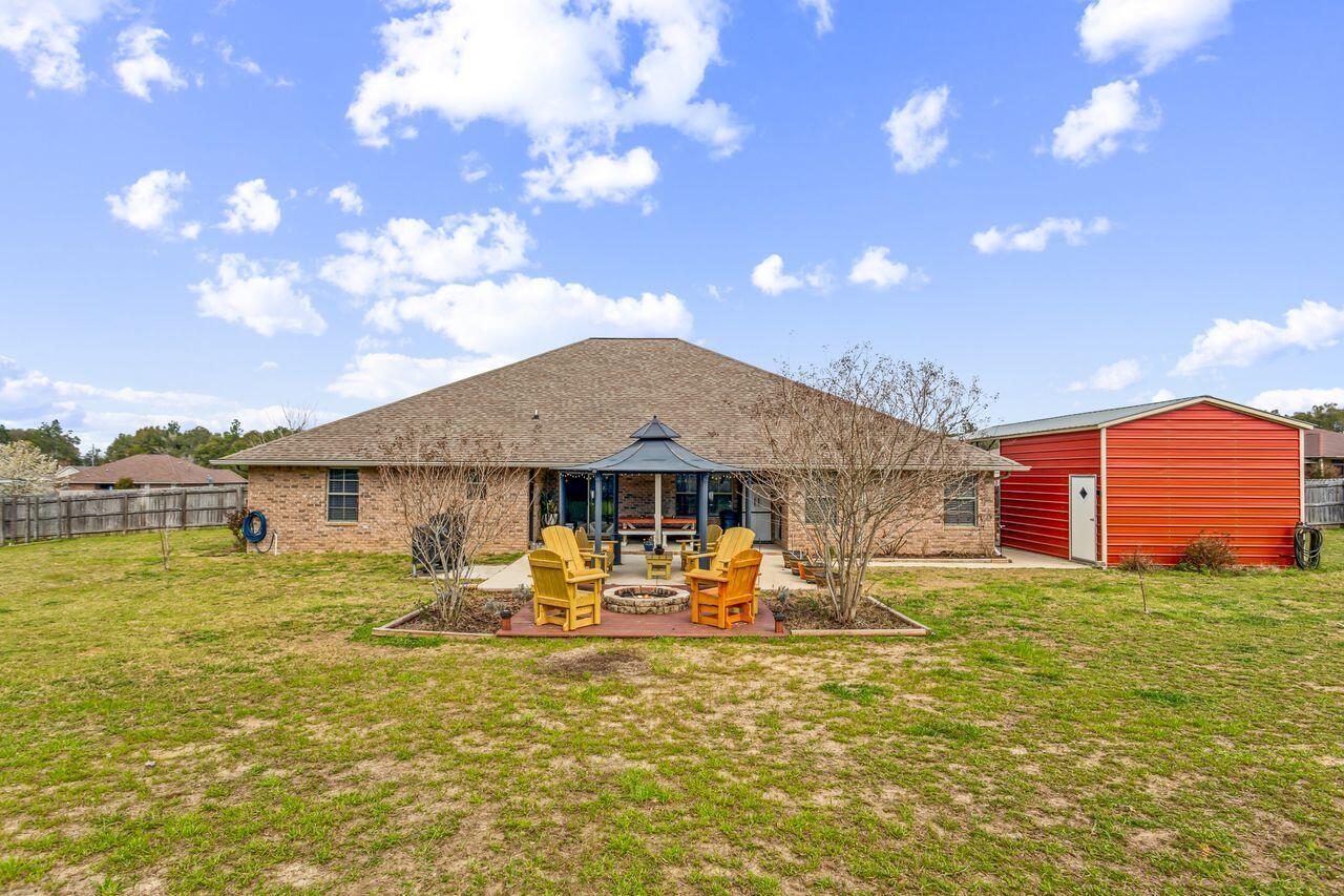 6256 Evan Circle Crestview, FL 32536 - Photo 35 of 46 a front view of a house with patio