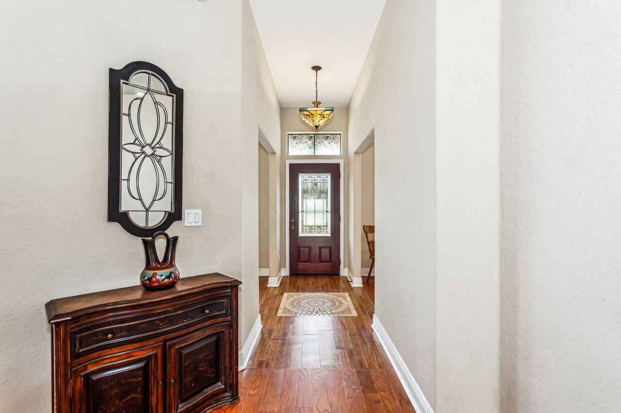 6256 Evan Circle Crestview, FL 32536 - Photo 5 of 46 a view of hall way with furniture and wooden floor