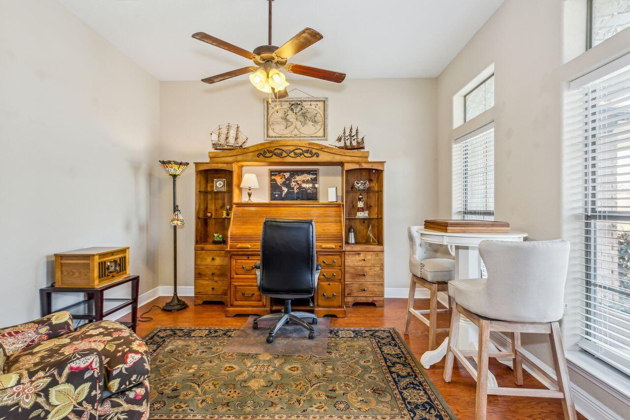 6256 Evan Circle Crestview, FL 32536 - Photo 6 of 46 a view of a workspace with furniture and a chandelier