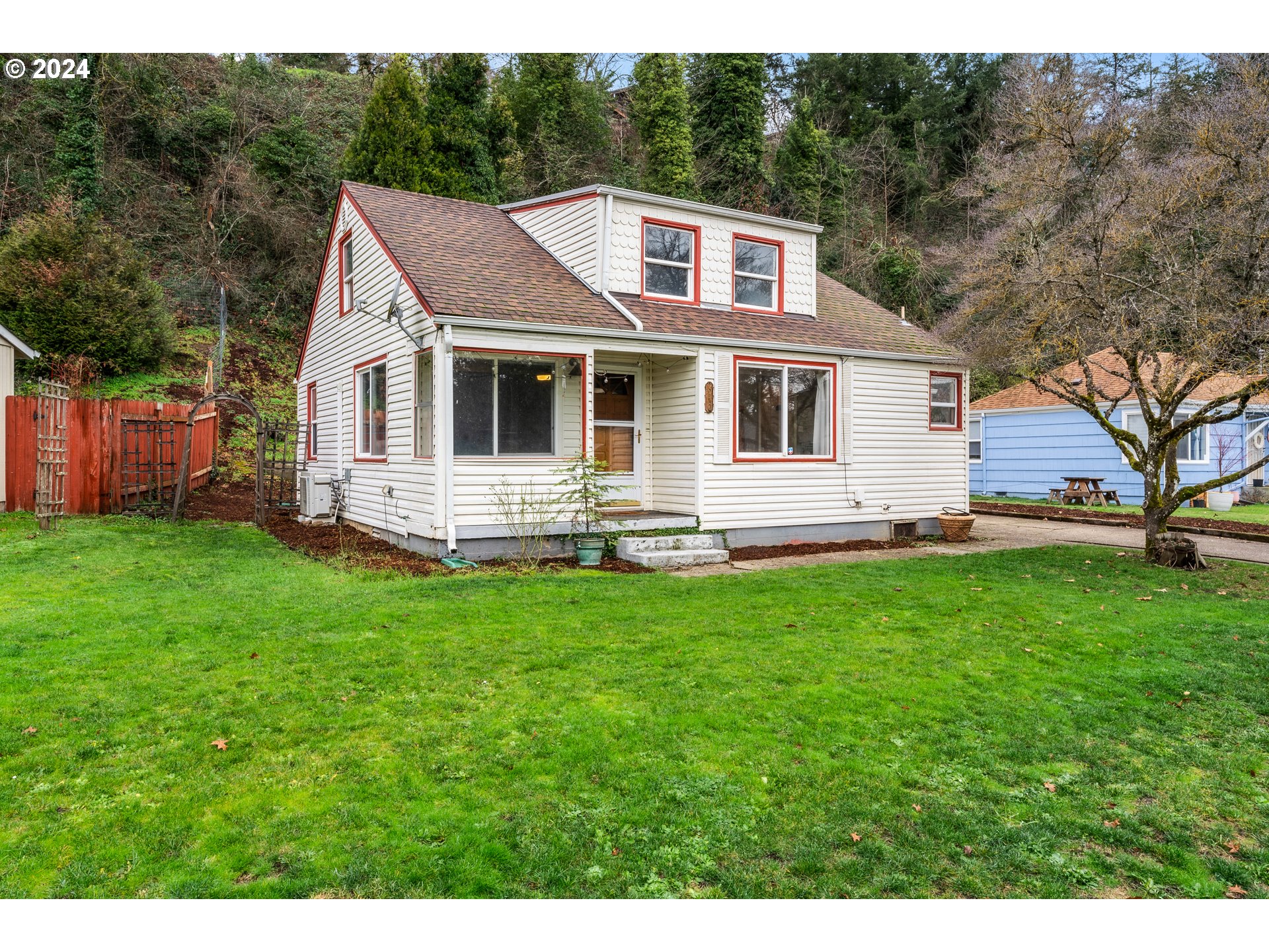 a front view of a house with a yard