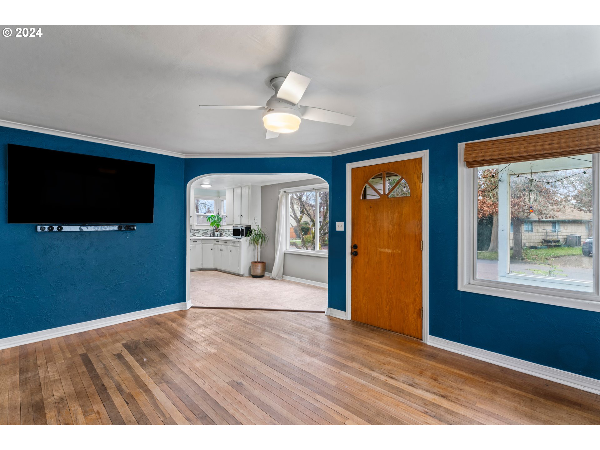 840 Kelly Boulevard Springfield, OR 97477 - Photo 5 of 27 a view of empty room with wooden floor and fan