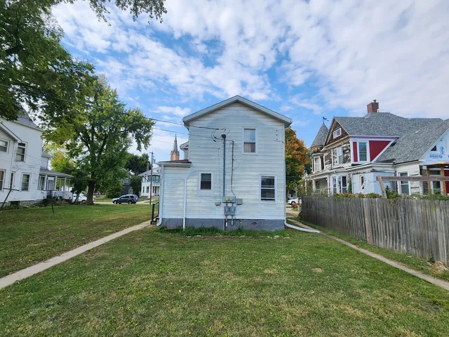 a view of a house with a back yard