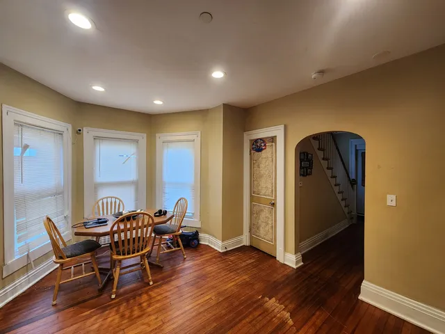 a view of a livingroom with furniture and wooden floor