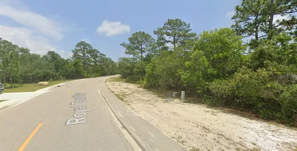 a view of a road with a yard