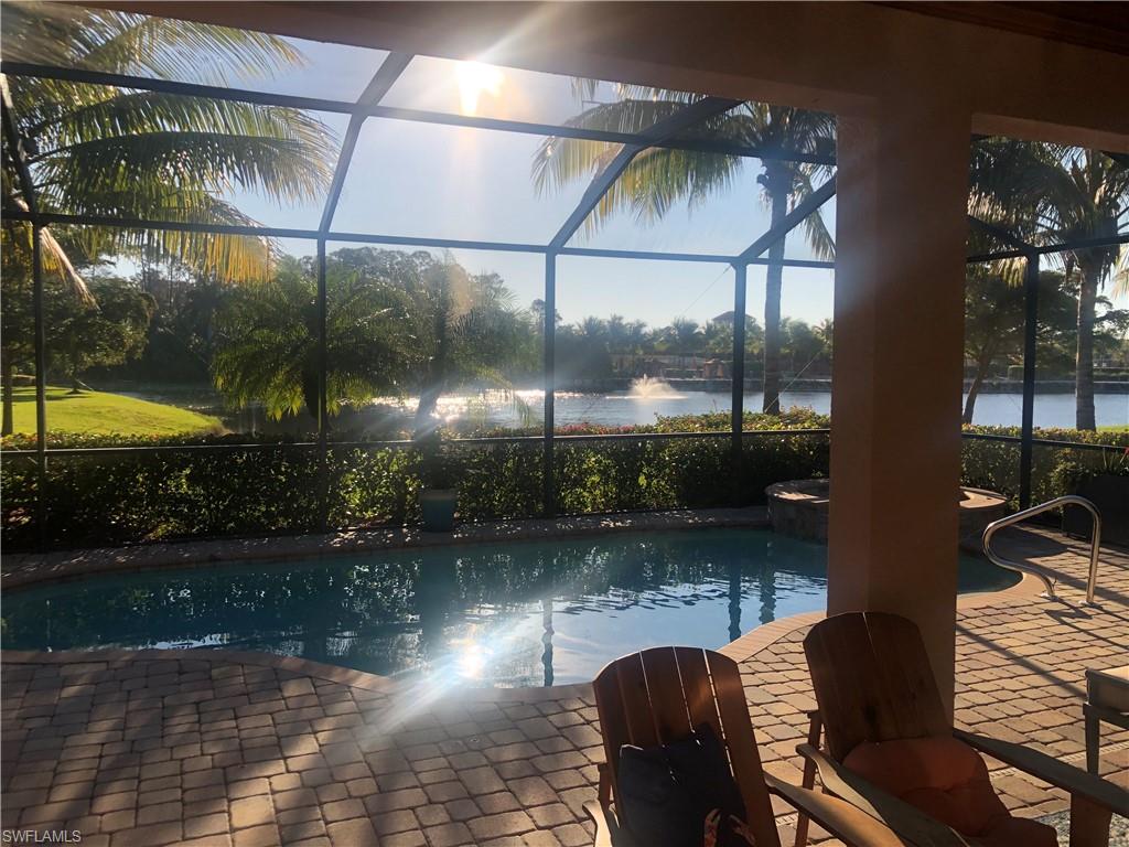9474 Piacere Way Naples, FL 34113 - Photo 3 of 17 a view of a swimming pool with a patio
