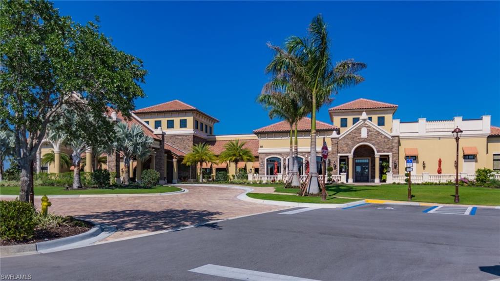 9474 Piacere Way Naples, FL 34113 - Photo 5 of 17 a front view of building with yard