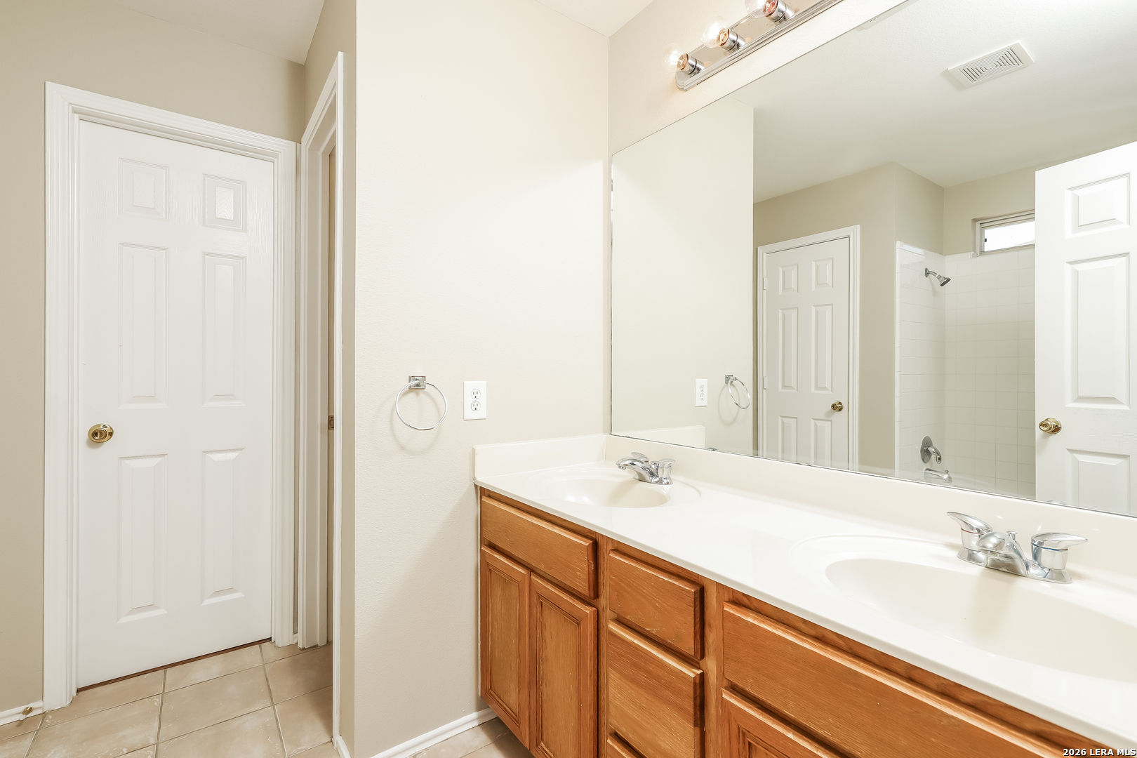 8611 Tioga Pass Helotes, TX 78023 - Photo 6 of 14 a bathroom with a sink and a mirror