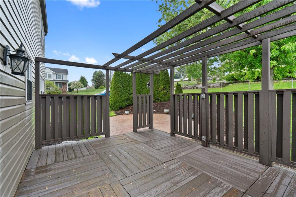 8961 Barnes Lake Road Irwin, PA 15642 - Photo 3 of 37 Private rear deck with pergola-style overhead trellis