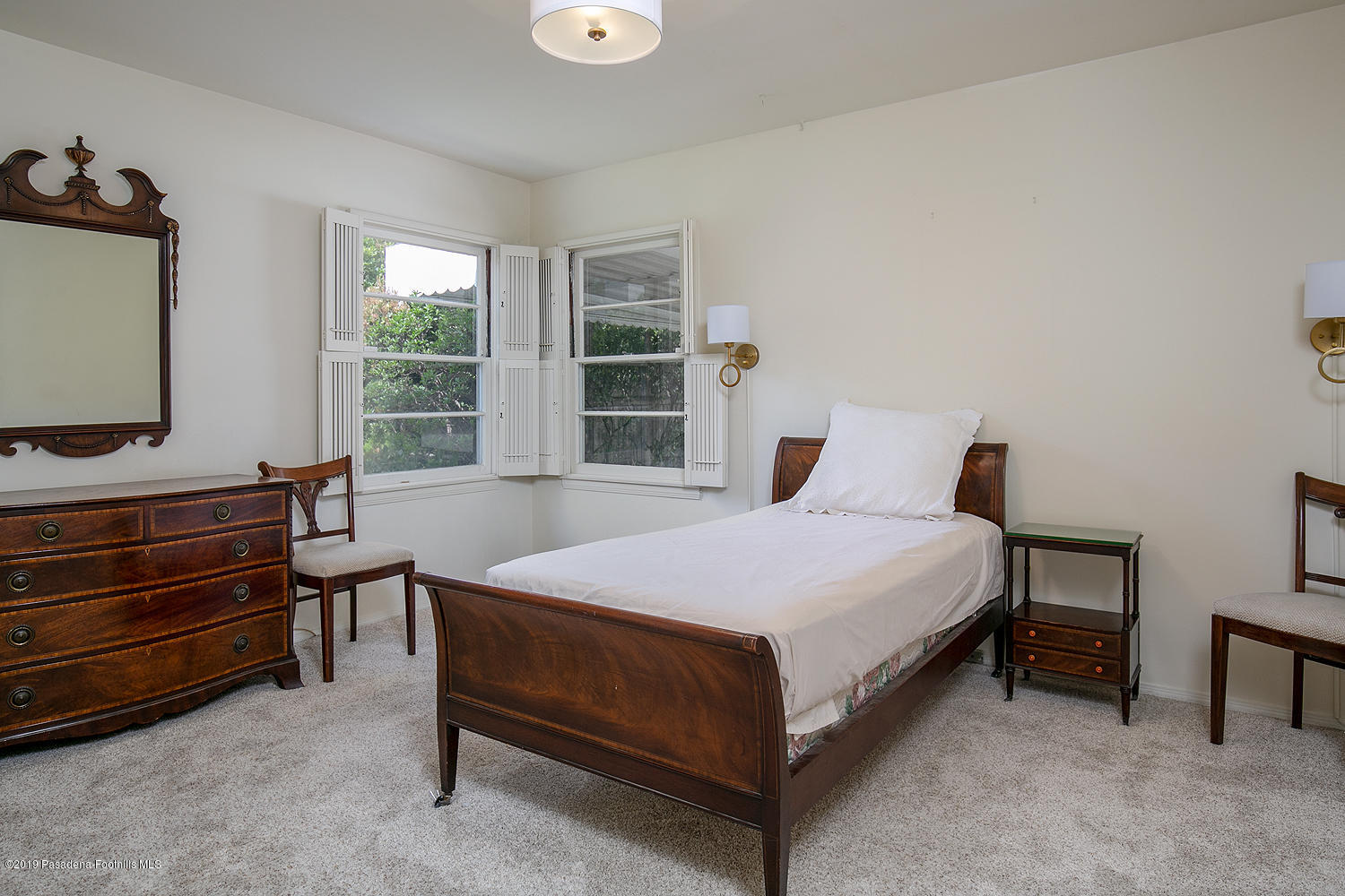 807 West Roses Road San Gabriel, CA 91775 - Photo 12 of 17 a bedroom with a bed and a flat tv screen on dresser