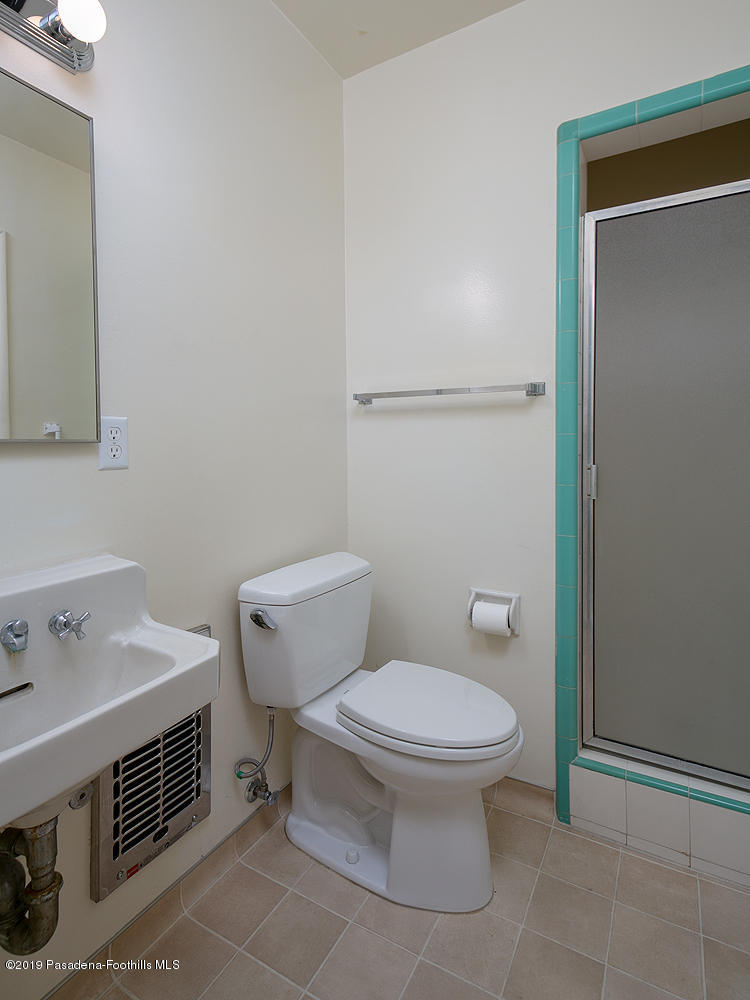 807 West Roses Road San Gabriel, CA 91775 - Photo 13 of 17 a white toilet sitting next to a bathroom sink