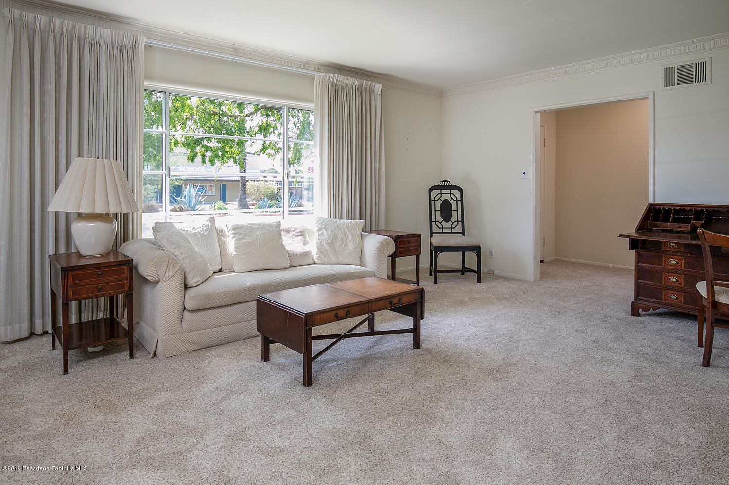 807 West Roses Road San Gabriel, CA 91775 - Photo 4 of 17 a living room with furniture and a window