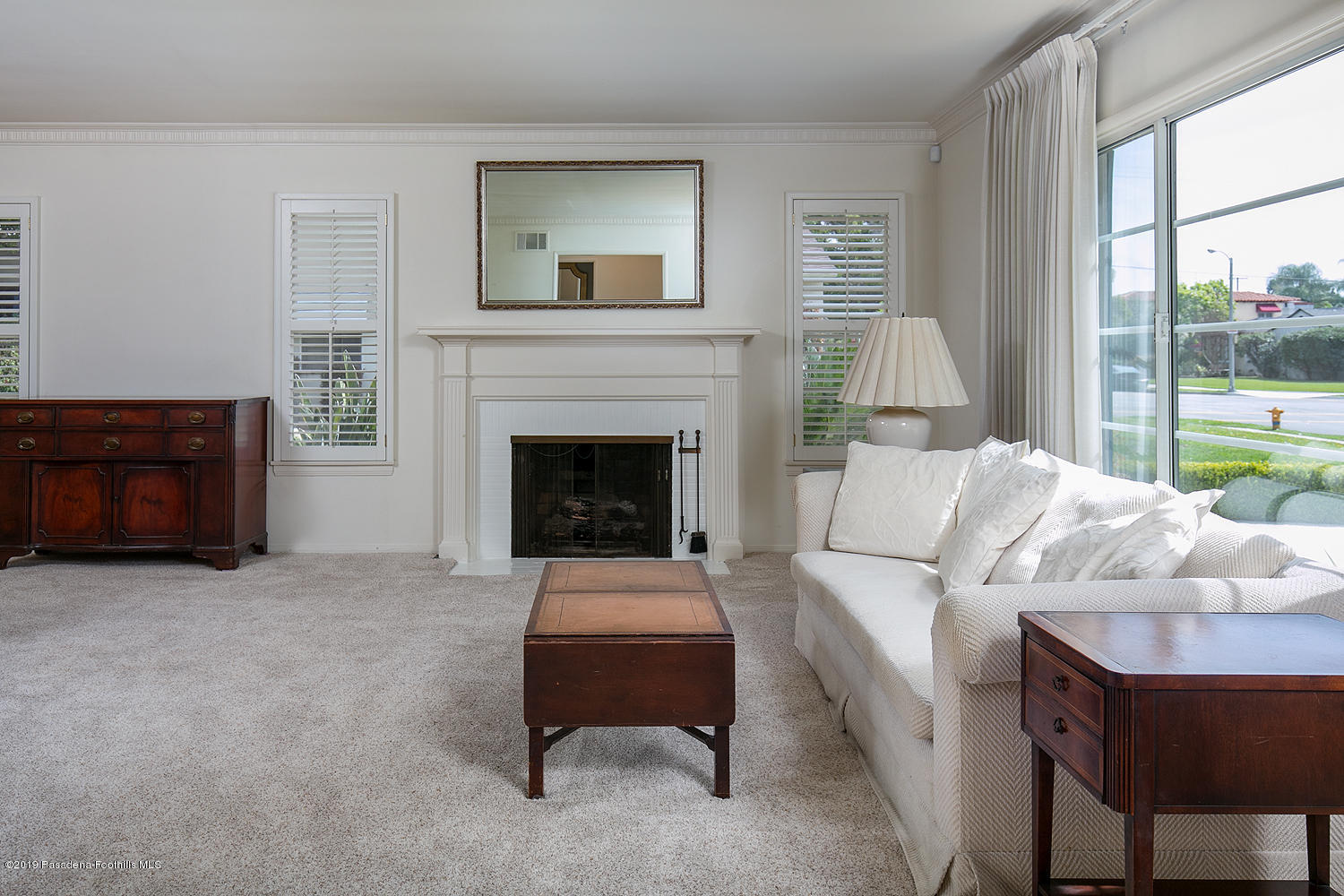 807 West Roses Road San Gabriel, CA 91775 - Photo 5 of 17 a living room with furniture and a fireplace