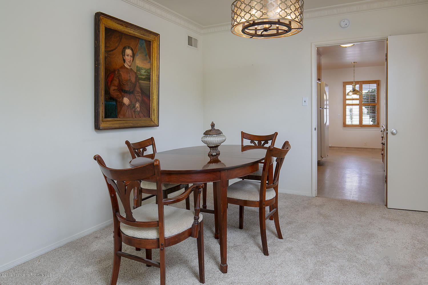 807 West Roses Road San Gabriel, CA 91775 - Photo 7 of 17 a dining room with furniture and a chandelier