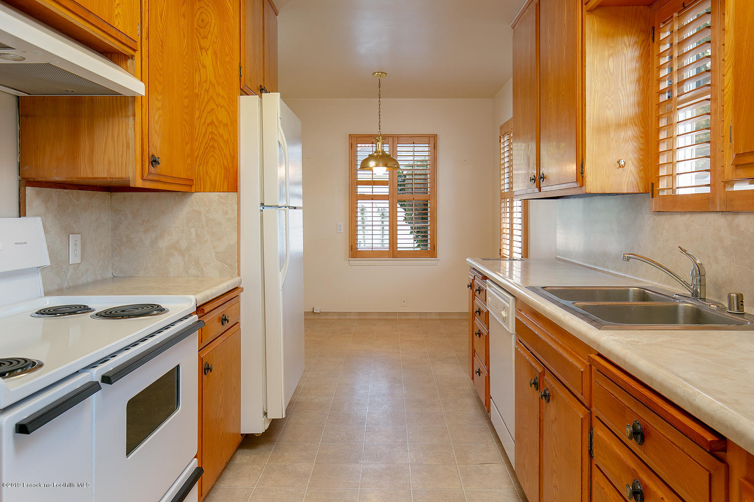 807 West Roses Road San Gabriel, CA 91775 - Photo 8 of 17 a kitchen that has a sink and a stove