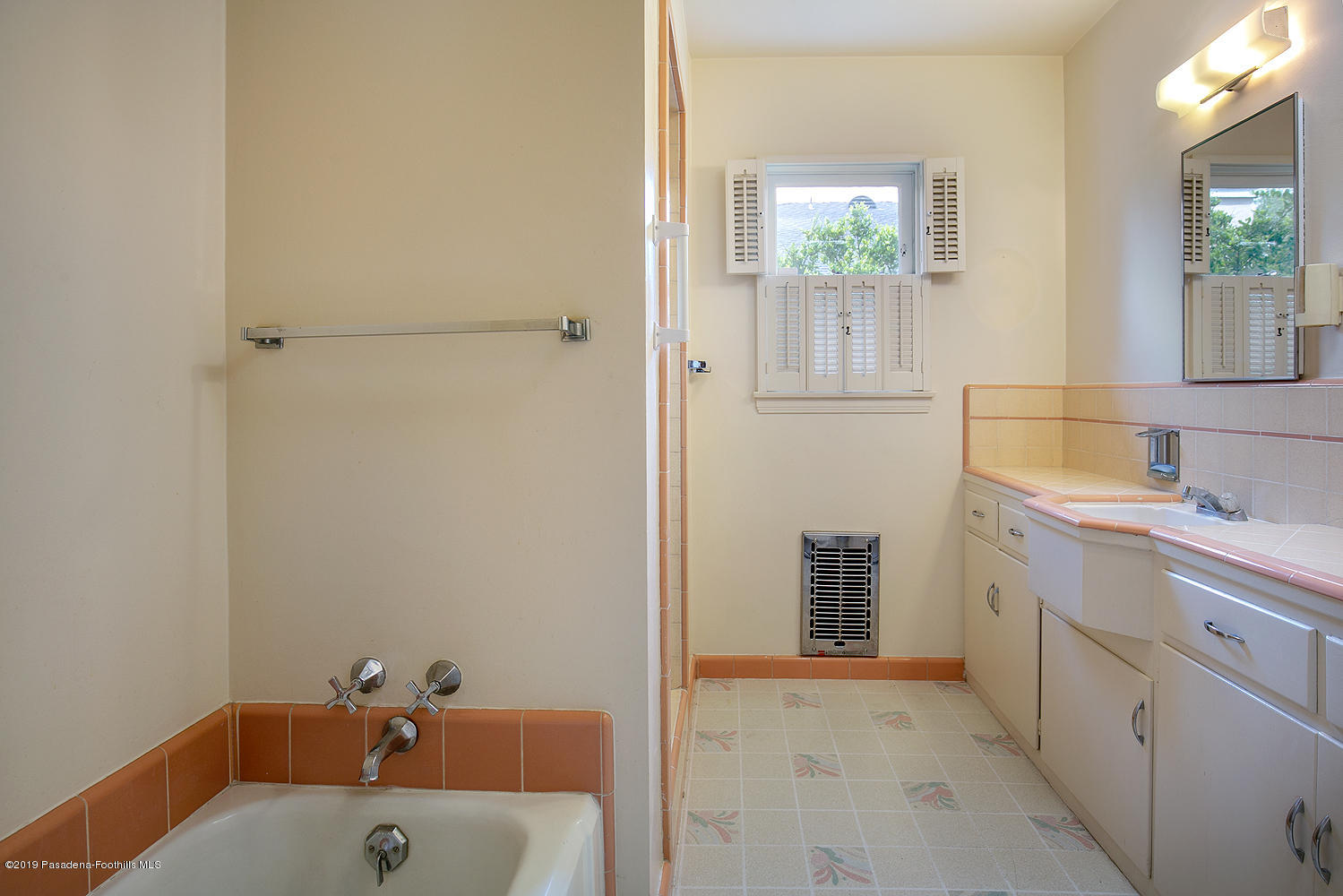 807 West Roses Road San Gabriel, CA 91775 - Photo 9 of 17 a bathroom with a bathtub sink and mirror