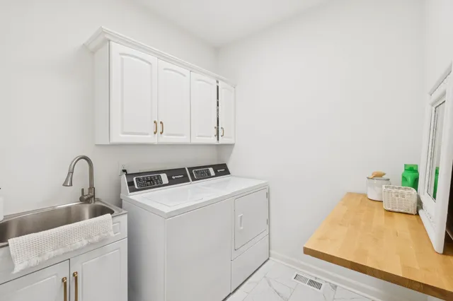 a view of a patio with couches and a potted plant