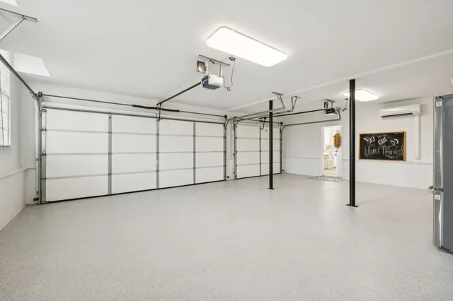 a view of a patio with table and chairs and potted plants