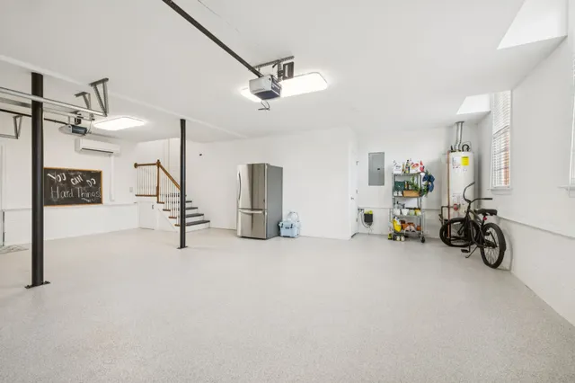 a room with furniture and potted plants