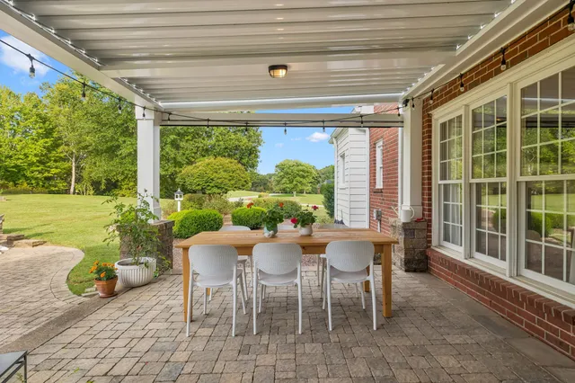 a front view of house with yard and seating area