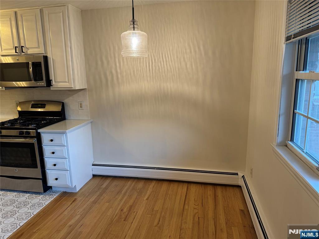 511 Washington Drive Ramsey, NJ 07446 - Photo 6 of 8 a view of a kitchen with storage and utility