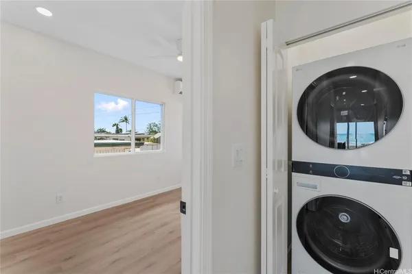 a view of a hallway with washer and dryer