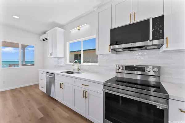a kitchen with a stove and a microwave