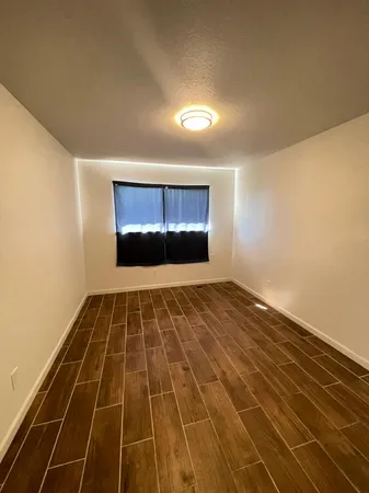 an empty room with a chandeliers