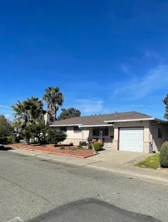 a group of cars parked in front of a house