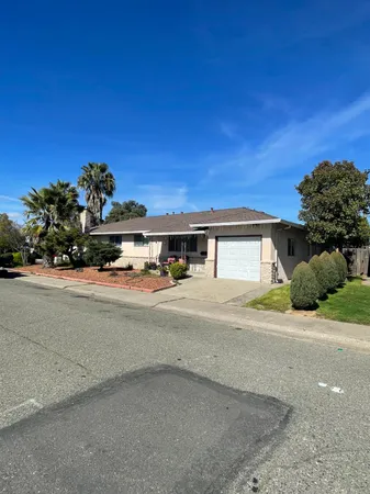 a view of a house with a street