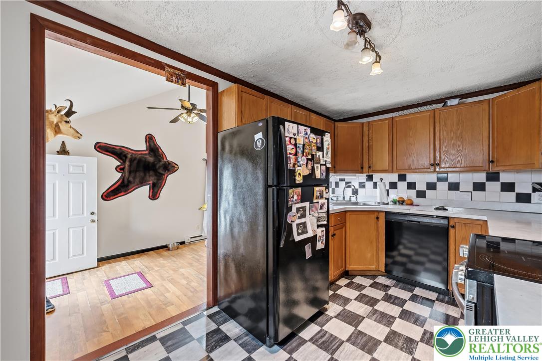 115 North Liberty Street Nazareth, PA 18064 - Photo 12 of 27 a kitchen with stainless steel appliances granite countertop a refrigerator and a sink
