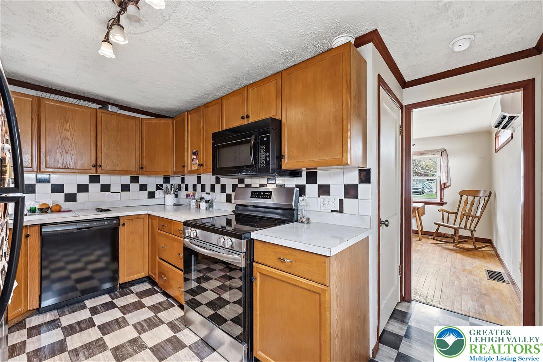 115 North Liberty Street Nazareth, PA 18064 - Photo 13 of 27 a kitchen with stainless steel appliances granite countertop a sink stove and refrigerator