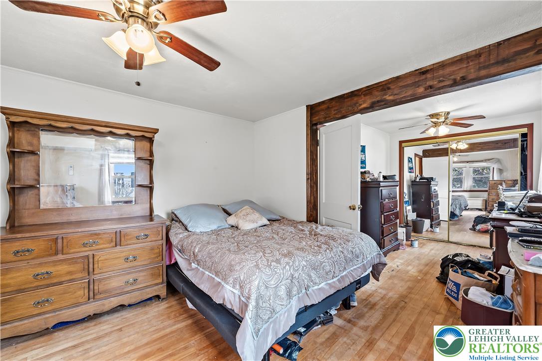 115 North Liberty Street Nazareth, PA 18064 - Photo 10 of 27 a bedroom with a bed and ceiling fan