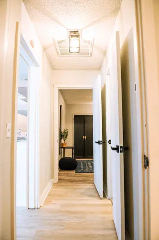 a view of a bedroom from a hallway