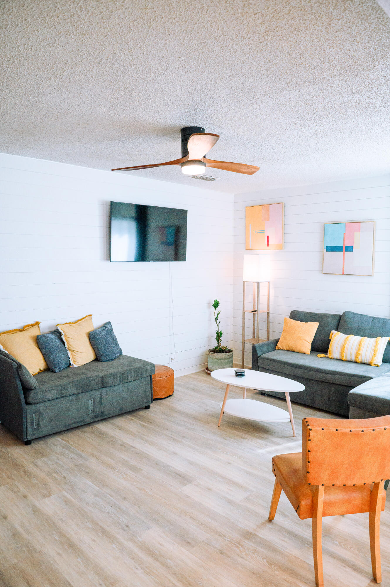 2436 24th Street, Unit FRONT Lubbock, TX 79411 - Photo 4 of 24 a living room with furniture and a flat screen tv