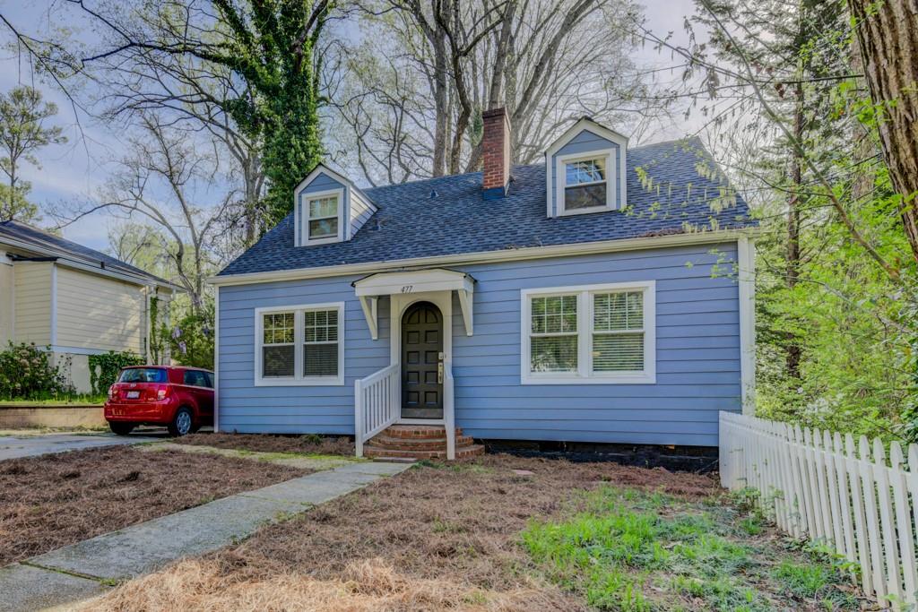 477 Burlington Road Northeast Atlanta, GA 30307 - Photo 1 of 1 a front view of a house with a yard