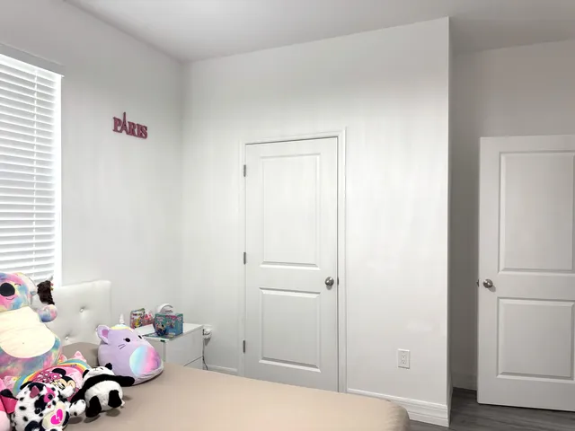 a bedroom with a bed and furniture