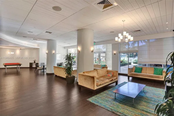 a room with lots of furniture and wooden floors