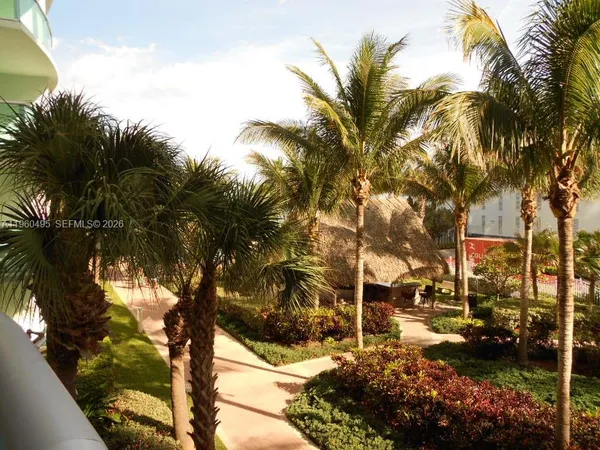 a balcony with view of yard