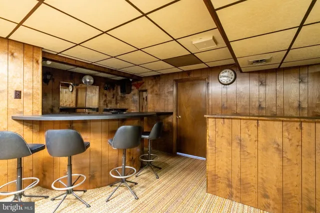 an empty room with a wooden walls