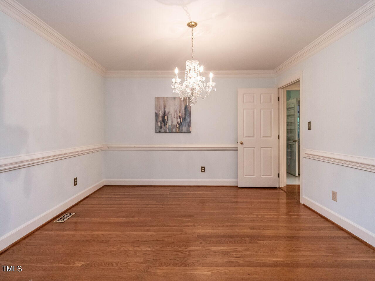 7805 Highlandview Circle Raleigh, NC 27613 - Photo 11 of 33 a view of a room with wooden floor and chandelier